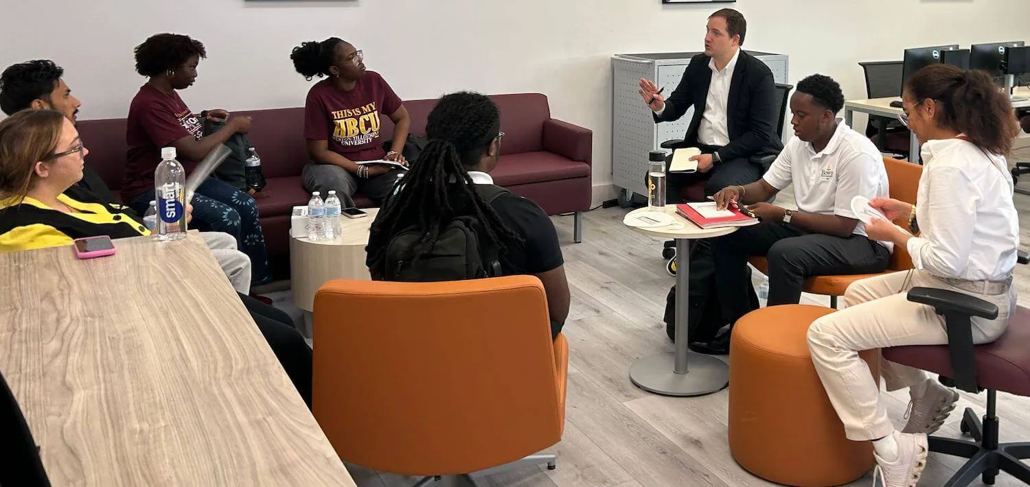 Dr. Andrew Mangle discussing with students