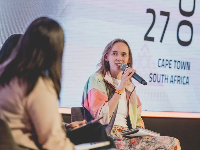 Lady with microphone on stage at Interledger Summit