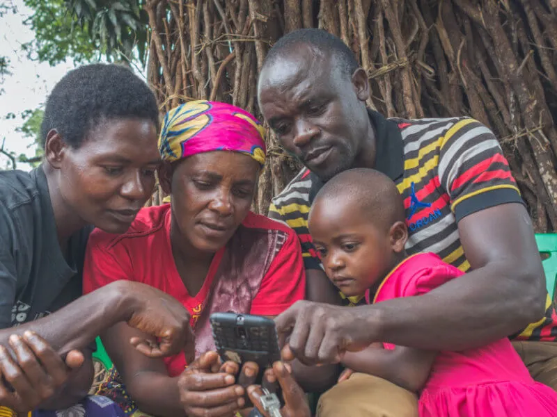 People looking at a mobile device